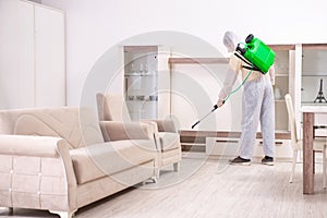 The pest control contractor working in the flat