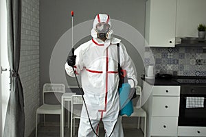 Pest control. Disinfection of premises against insects and rodents by chemical means, a sanitary worker with a spray