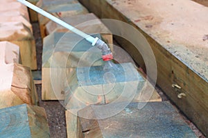 Pest control treatment of wood