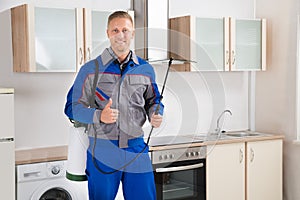 Pest Control Worker With Insecticide Sprayer photo