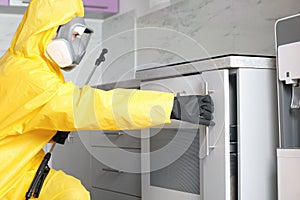 Pest control worker opening drawer