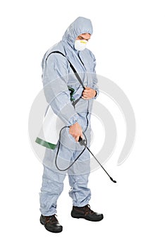 Pest control worker with pesticides sprayer