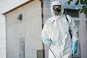 pest control worker in respirator holding