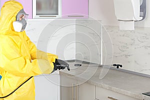 Pest control worker spraying pesticide