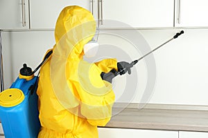 Pest control worker spraying pesticide