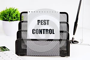 Pest Control written on a piece of paper on a white background