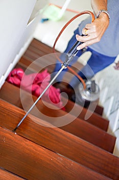 Pest / termites control services on wood stair in the new house that have termites signs inside it