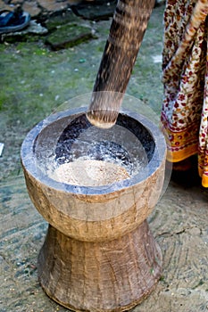 Pesting beans in a Ukhal musal (Mortal and Pestle