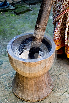 Pesting beans in a Ukhal musal (Mortal and Pestle