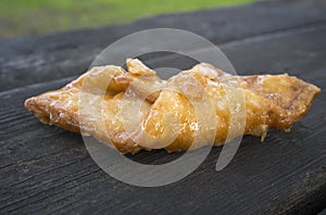 Pestino glazed with honey over dark wooden background photo