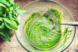 Homemade pesto alla Genovese with fresh basil photo