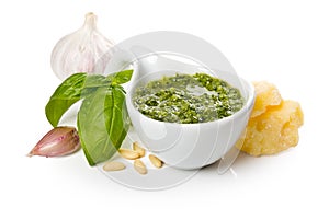 Pesto Genovese in a gravy boat and ingredients