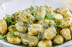 Pesto gnocchi, garlic and fresh herbs olive oil