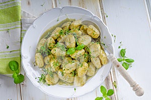 Pesto gnocchi, garlic and fresh herbs olive oil