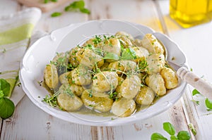 Pesto gnocchi, garlic and fresh herbs olive oil