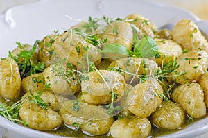 Pesto gnocchi, garlic and fresh herbs olive oil