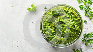 Pesto sauce jar on white background with copy space for food themes, ads, and culinary designs