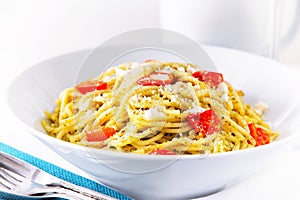 Pesto spaghetti with cherry tomato.