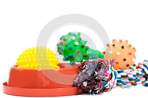 Pet accessories concept : Bowl, ball and rope for bite on white