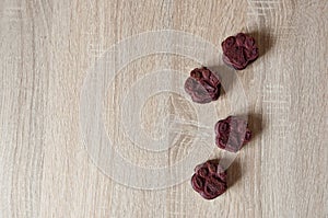 pet cake. dog treat. pastry food for cat. appetizing dog muffins on wooden background. pet birthday. red velvet. paw shaped dog