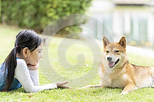 Pet Lover. Shiba Inu dog and girl In the park in the spring. Shiba Inu is a dog in the Spitz group of Japan
