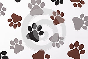 Pet paws on white background, dog paws pattern. National Puppy Day creative concept