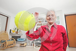 Pet's prospective. Grandmother paly wits a tennis ball.