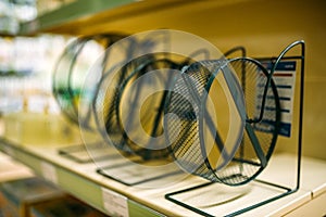 Pet shop, shelf with hamster wheels, closeup