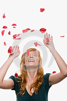 Petals falling on a woman