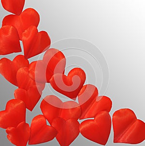 Petals in heart shape over gray background - frame