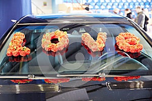 Petals of roses and flowers on a limousine from a wedding