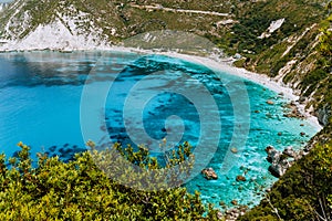 Petani beach in summer, Kefalonia island, Greece. View to Petani bay with transparent and crystal clear blue azure