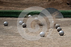 Petanque ball boules bawls on a dust floor