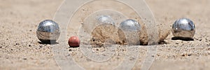 Petanque ball boules bowls on a dust floor photo
