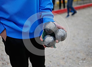 Petanque throwers iron balls during tournament
