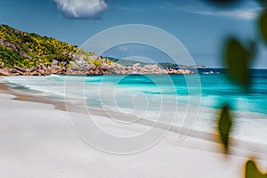 Petite Anse, La Digue in Seychelles. Tropcial, white sand paradise beach with turquise colored water on bright sanny day photo