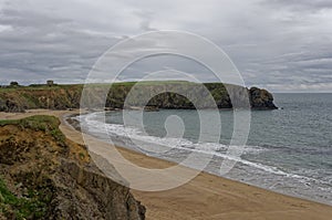 Petits Bay and Baginbun Head on an overcast day in October