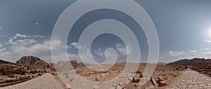 Petra ancient stone Qasr al-Bint gate and ruins with tiled road