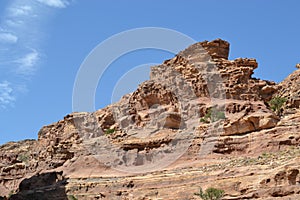 Petra, Jordan - ancient Nabatean city in red natural rock and with local bedouins, UNESCO world heritage