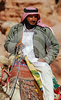 Men looks for tourists for camel ride.