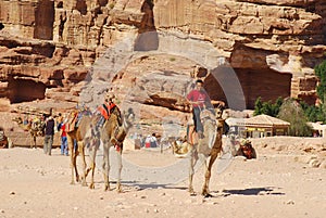 Unidentified men looks for tourists for camel ride