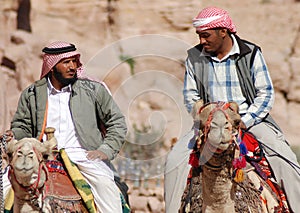 Men looks for tourists for camel ride.