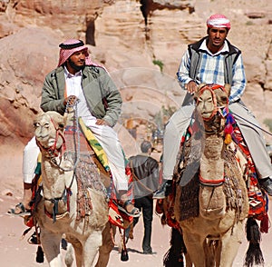 Men looks for tourists for camel ride.