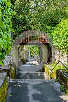 Petra Stube or Petar Kruzic Stairway in Rijeka, Croatia with arch ivy on walls