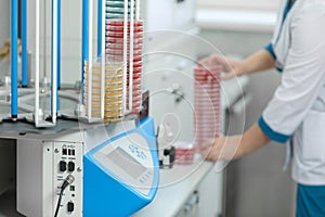 A petri dish in the hands of a laboratory assistant, a medical laboratory