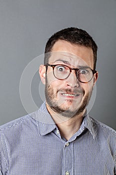 Petrified bearded entrepreneur grinding teeth for business stress