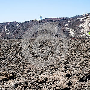 Petrified lava flow close up on slope of Etna