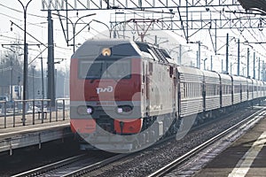 Electric locomotive EP2K-350 with a passenger train on the Slavyanka station