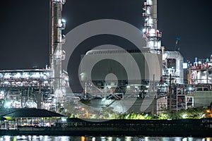 Petrochemical oil refinery and sea in industrial engineering concept in Bangna district, Bangkok, Thailand. Oil and gas tanks