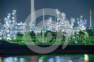 Petrochemical oil refinery and sea in industrial engineering concept in Bangna district, Bangkok, Thailand. Oil and gas tanks